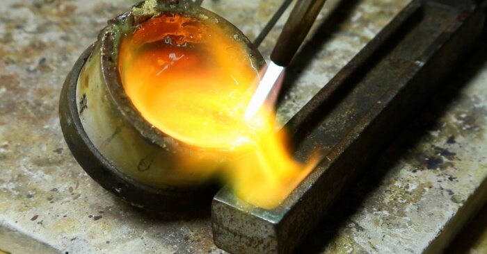 Molten gold being poured into a mold