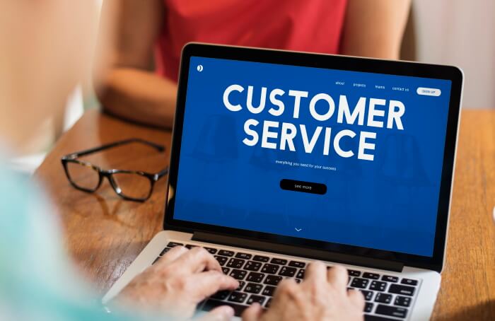 The words "customer service" on laptop screem