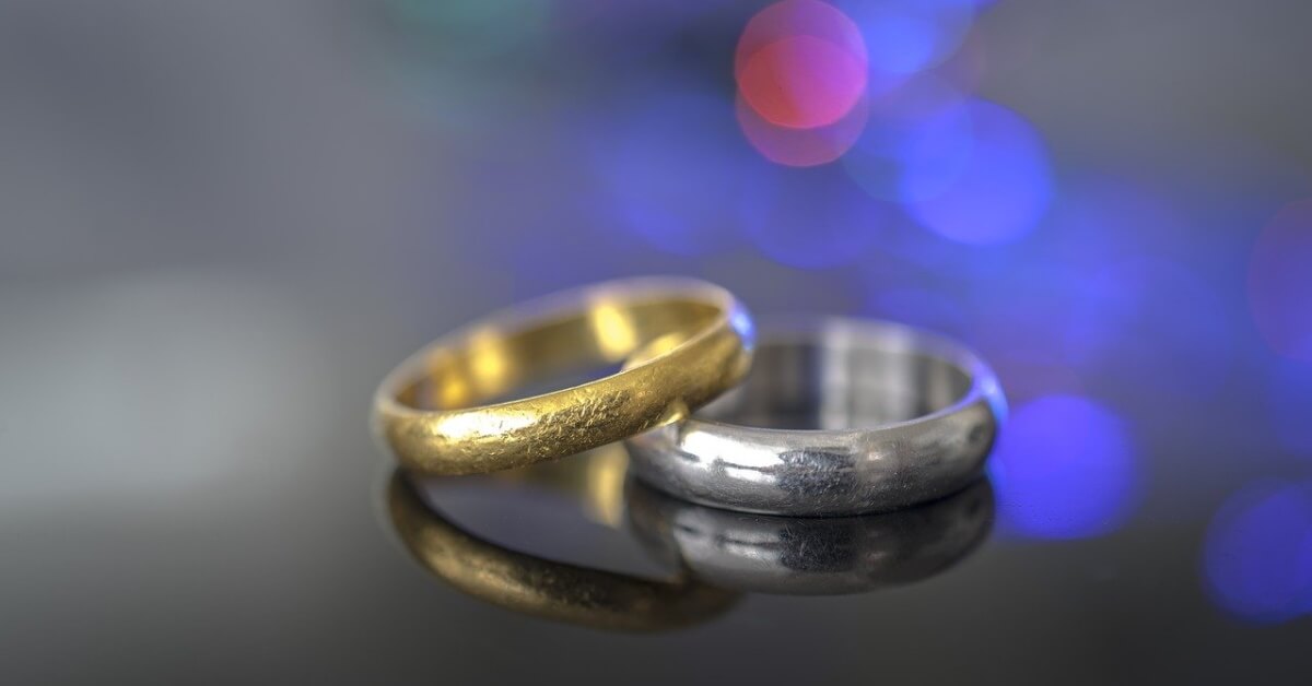 Gold ring resting on platinum ring