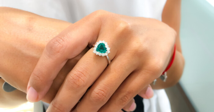 Heart-shape emerald engagement ring with diamonds