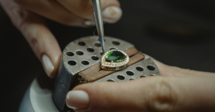 Jeweler making an emerald ring
