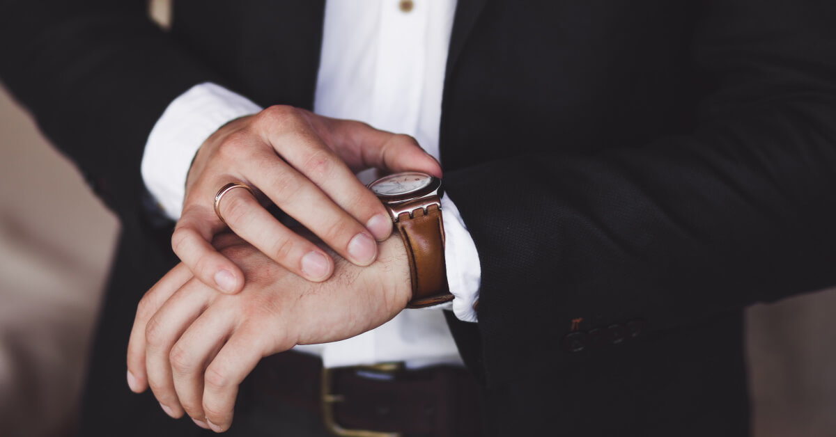 Man touching luxury watch on his wrist