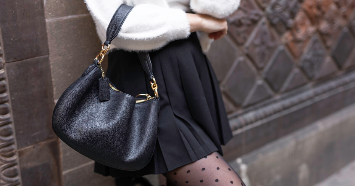 Close up of woman with luxury handbag
