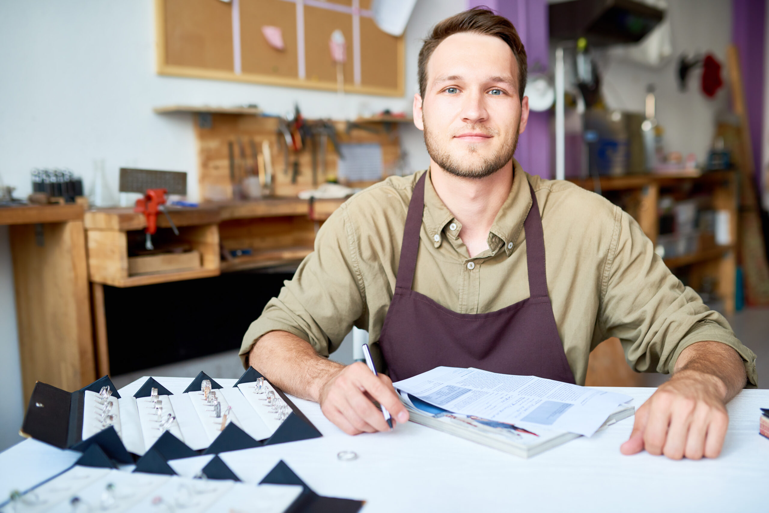 Young male appraiser in Los Angeles pawn shop